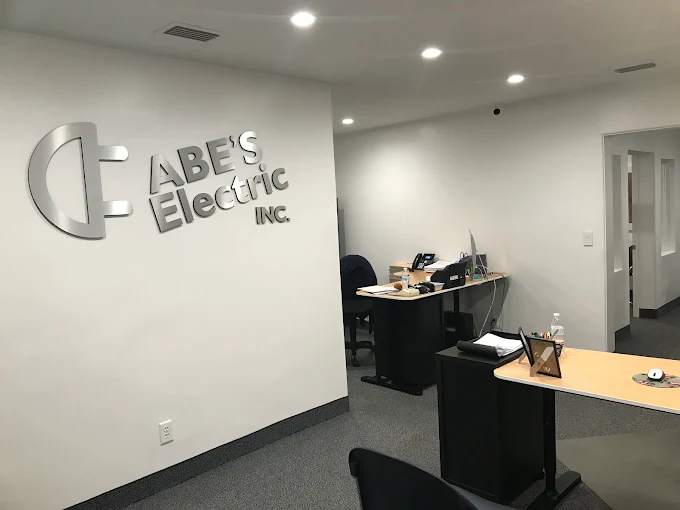 ABE'S Electric, Inc. office lobby with the company sign in Kissimmee, Florida